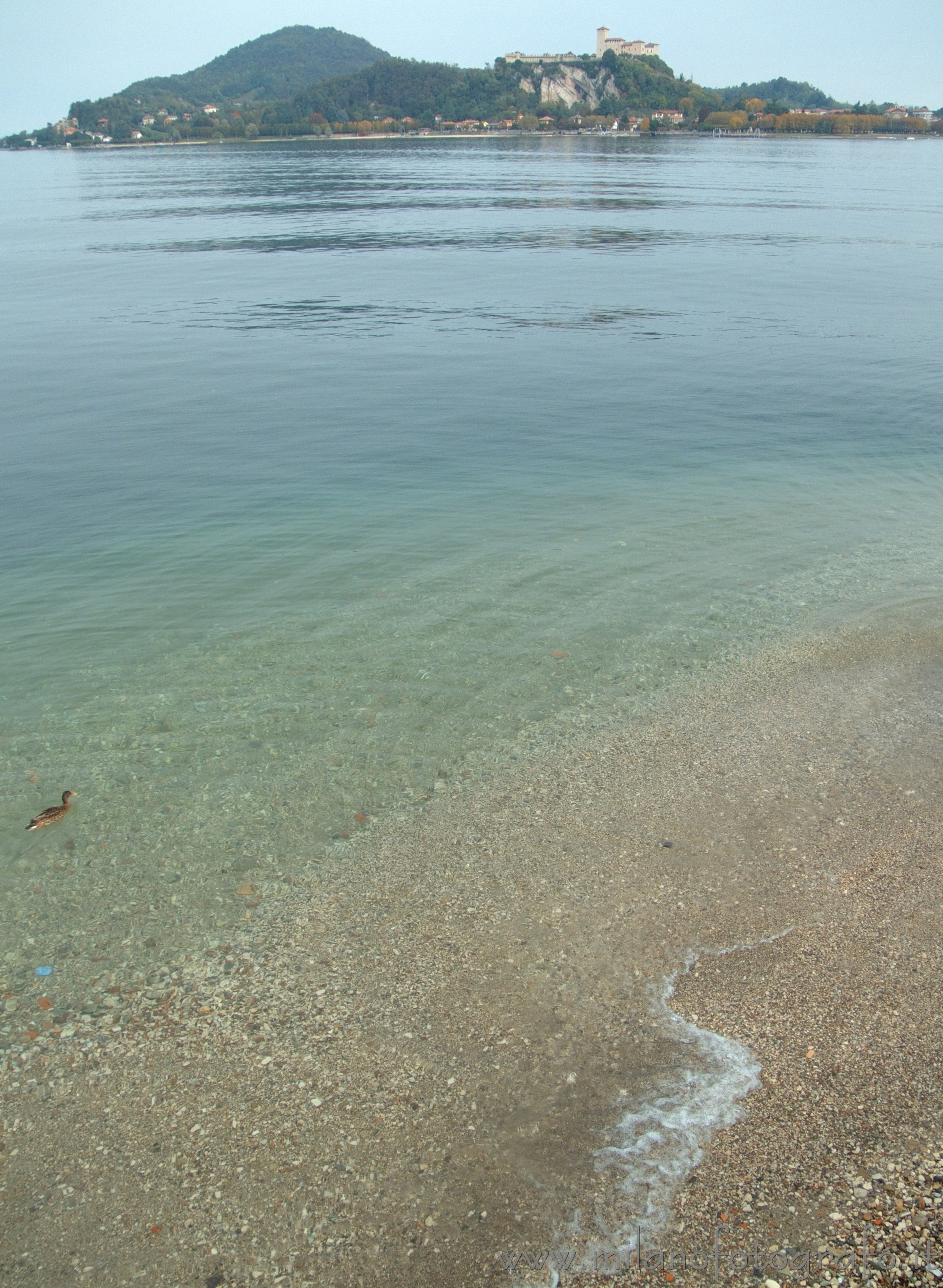 Arona (Novara, Italy): The beach of Arona with the Castle of Angera in the background - Arona (Novara, Italy)