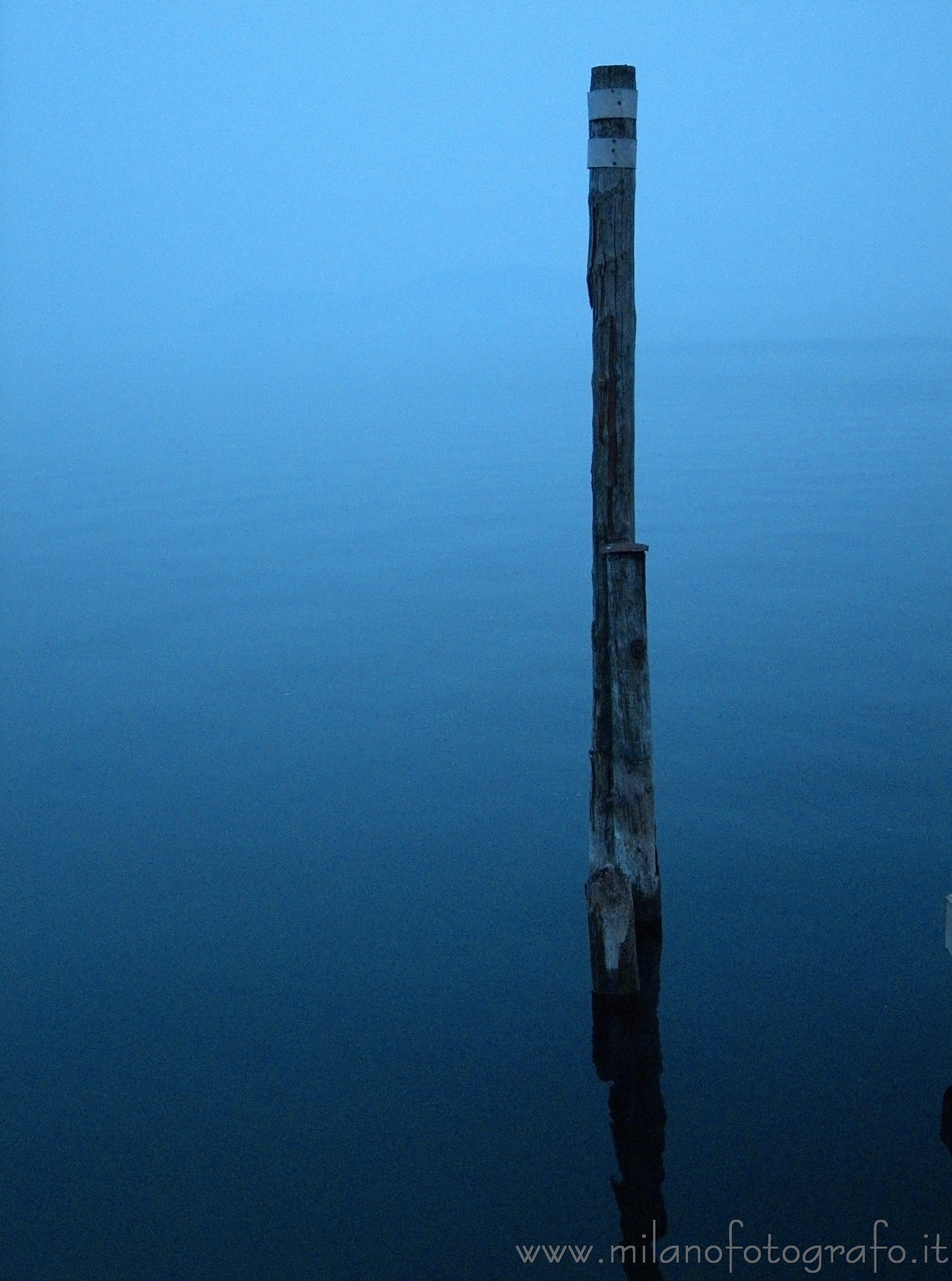 Belgirate (Novara, Italy) - Pole in Maggiore Lake in the fog