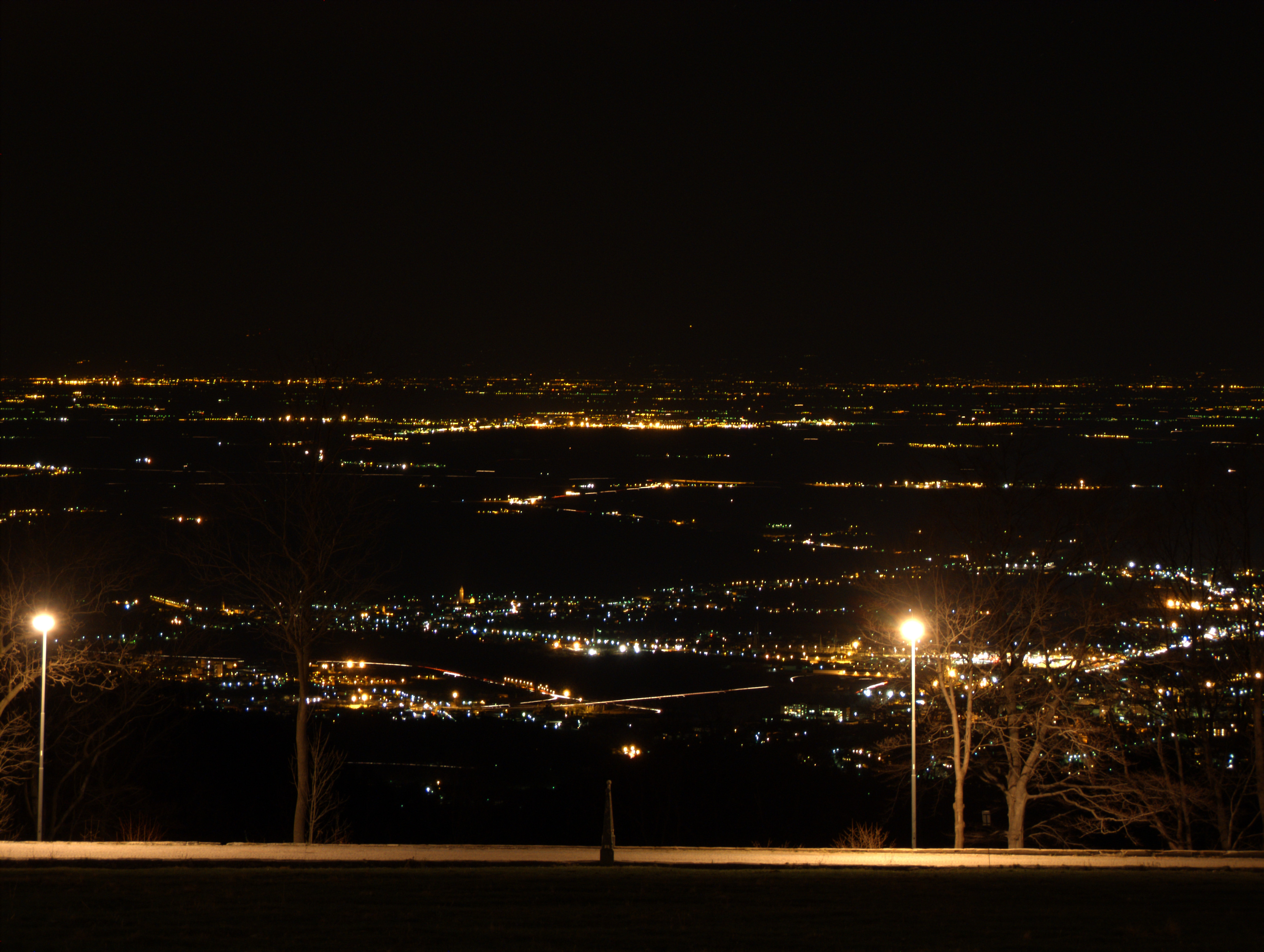 Biella (Italy): View on the plane by night from the Sanctuary of Oropa - Biella (Italy)