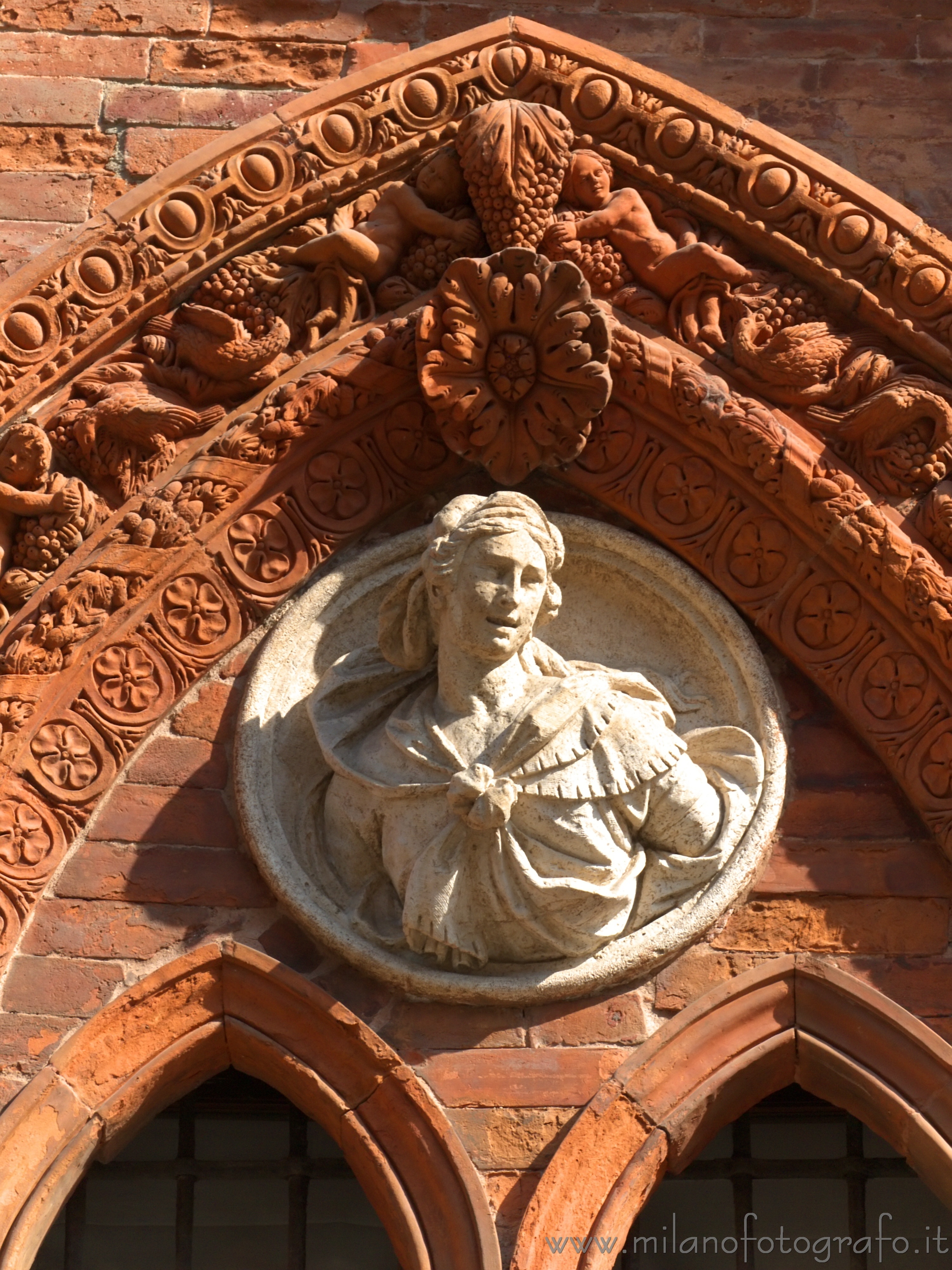 Milan (Italy): Detail of one of the gothic windows of the once Ca'Granda hospital - Milan (Italy)
