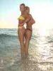 Torre San Giovanni (Lecce, Italy): Girls on the beach at the border of the sea