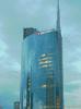 Milan (Italy): The cloudy sky reflected on the Unicredit tower