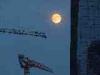 Milan (Italy): The moon behind the skyscrapers in Garibaldi