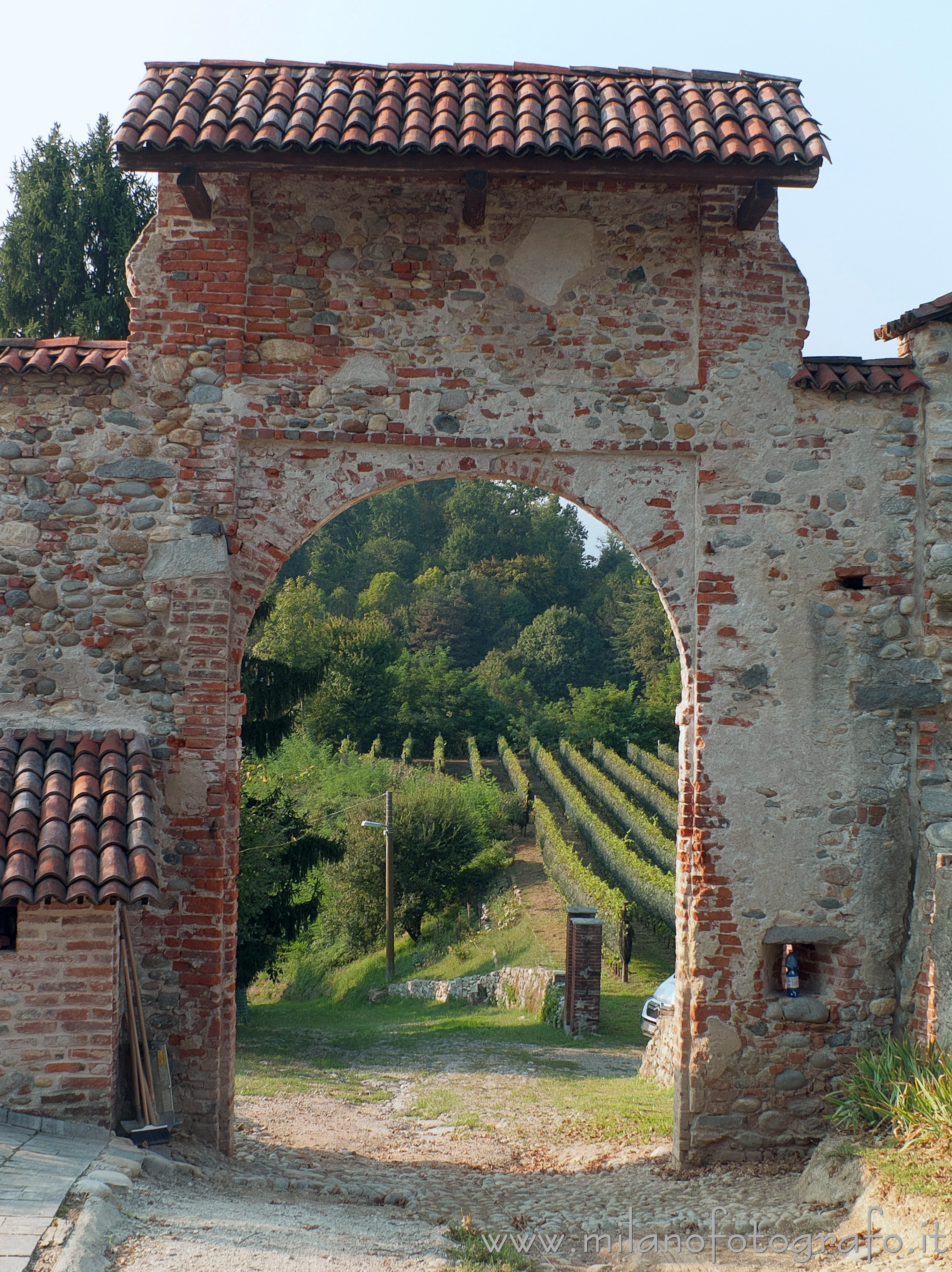 Cossato (Biella, Italy): The vineyards of Castellengo seen through the Gate of the Moor of the Castle of Castellengo - Cossato (Biella, Italy)
