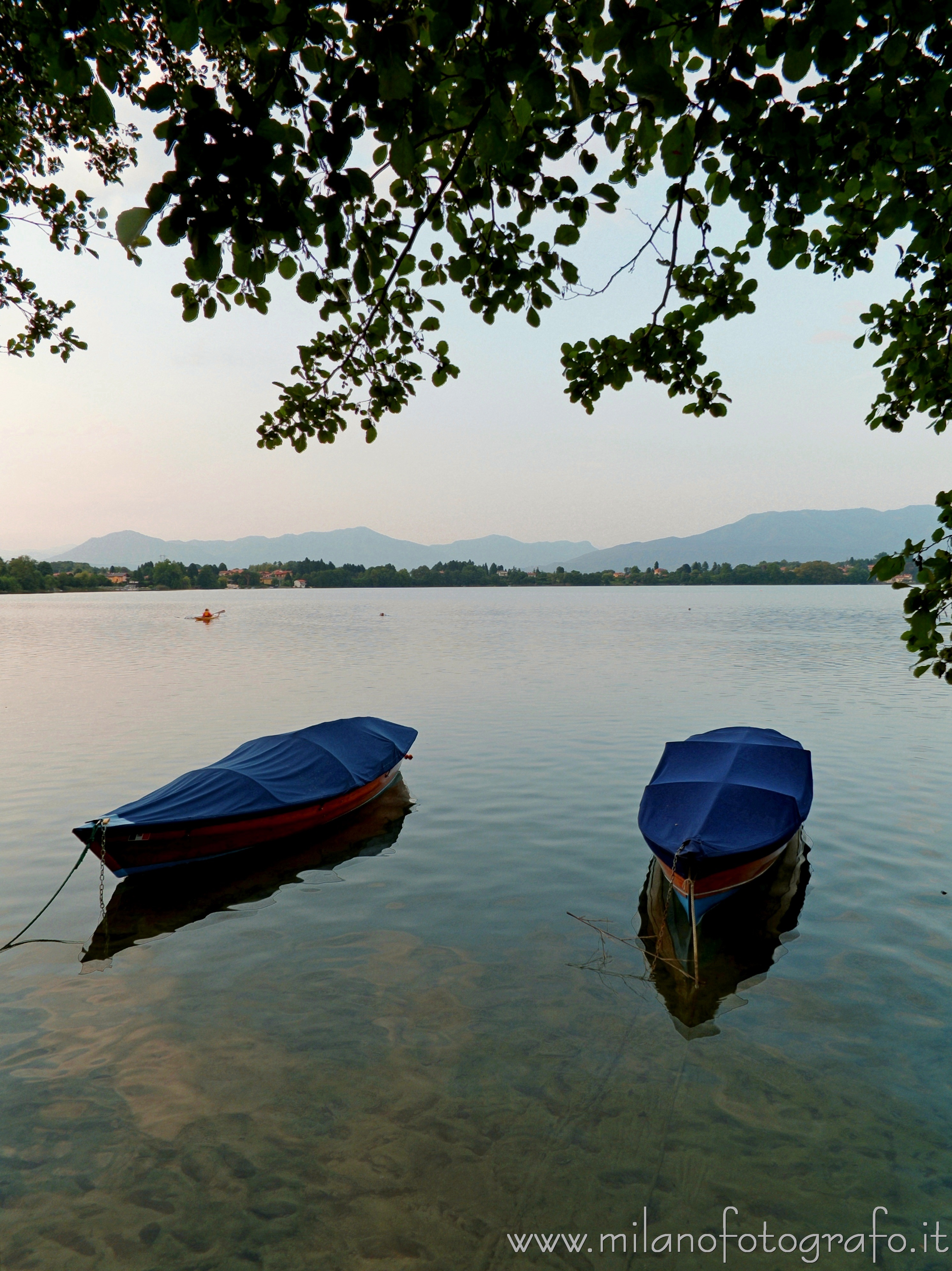 Cadrezzate (Varese, Italy): Two boats moored in Lake Monate at darkening - Cadrezzate (Varese, Italy)